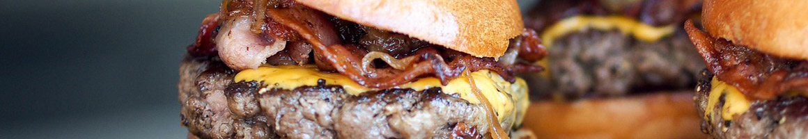 Eating American (Traditional) Burger at Mama Burger restaurant in Flagstaff, AZ.